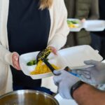 Young woman receiving takeaway food